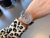 38mm女性フルダイヤモンド腕時計ファッションT CZムーンシェイプエクイノックスクロッククォーツ腕時計グリーンダイヤモンド男性有名な時計AAA +