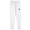 Män avslappnade sportbyxor damer mode street stil byxor mäns dagliga slitage bekväma tröjor unisex fast färg joggar bottnar