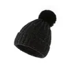 Hiver chaud chapeau de fête épais câble tricot fausse fourrure floue Pom crâne casquette polaire doublé manchette bonnet pour les femmes