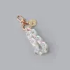 Keychains Latest Clear Acrylic Link Chain Gold Button Key Design Bluetooth Headset Car Bag Hanging Pendant Decor Miri22