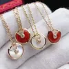 2021 fashion Ka jia amulet necklace natural white fritillary red black agate pendant female plated 18K gold clavicle chain wholesale 018