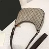 Den nya berömda brevbeslagen Luxury Lady Axel Väskor Kuvert Designers Plånböcker Handväskor Läder Shopping Kvinnor Plain Messenger Underarm Handväska Zipper Tote