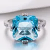 Fedi nuziali che vendono anello di fidanzamento in argento placcato principessa con pietre americane intarsiate a forma di mare blu