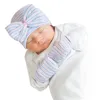 新生児の病院の帽子幼児の赤ちゃんの帽子の帽子の弓の柔らかいかわいい保育園の帽子の頭蓋骨の帽子とスクラッチミトン