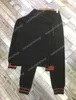 2021 New Designer Tracksuit de lujo Ropa de lujo Chaqueta Red Rainker Breakter Outwear Abrigo Classic Letters Traje Patchwork Sportwear Pantalones