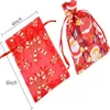 Confezione regalo all'ingrosso moda organza stampa natalizia borsa a rete con coulisse anno pacchetto decorazione albero festa