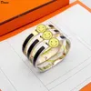 Braccialetto di lusso per gioielli Donia Classico della moda europea e americana esagerato bracciale in acciaio al titanio con lettera in metallo largo 8 mm con scatola