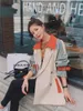 Trench femme 2022 couleur assortie coupe-vent printemps automne coréen lâche pardessus court grande taille manteau britannique avec ceinture