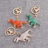 Metalen schattige strass-crystal dinosaurus-sleutelhanger metalen pailletten-dieraandrijving-veilige sleutelhanger sleutelhangers vrouwen auto tas hanger sieraden G1019