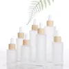Frostat Clear Glass Dropper Bottle Essential Oil Perfume Kosmetiska Förpackning Flaskor med Imiterat Trä Lid 20ml 30ml 50 ml 60ml 100ml
