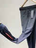 春と夏のスタイルの男性のズボンスリムな足のスウェットパンツ薄いセクション通気性カジュアルジョギングパンツ良い品質210715