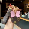 2021 NewCute Portachiavi per le donne Mens Designer Moda Portachiavi Animale cartone animato orecchie rotonde Fascino chiave Chiavi della macchina Borsa Ciondoli Charms Palla per capelli casual Regali