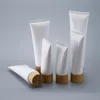 空白の白いプラスチック製の絞り管の瓶化粧品クリームジャー詰め替え可能な旅行リップバームのコンテナ竹キャップLLD12851