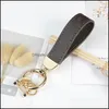 Keychains Fashion Accessories Pu Brown Car Printed Leather Keyrings Pendants Bag Charm Stylish Classic Key Rings For Men And Women Drop Deli