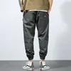 Calças masculinas ky-6892 primavera sweatpants simples esporte solto ao ar livre juventude estiramento casual elástico cintura laço pés calças