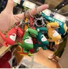 Figuras lindas llavero Dinosaurio Frog Figura colgando Ins Dibujos animados Hombres y bolsas para mujer Bolsos de coches Regalos colgantes