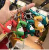 Leuke figuren sleutelhanger dinosaurus kikker figuur hangende ins cartoon mannen en vrouwen auto tassen hangende geschenken