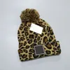 Nueva moda leopardo grano pelota bola beanie marca hombres mujeres invierno y otoño cálido alta calidad transpirable soportable sombrero de cucharón elástico con logo Caps de punto C008288