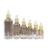 Clear Glass Dropper Bottle Cosmetic Packing Refillable Containers Empty Essential Oil Pipette Vials False Wood Plastic Lid 5ml 10ml 15ml 20ml 30ml 50ml 100ml