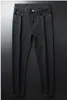 Yüksek Kaliteli Erkek Tasarımcı Lüks Kot Siyah Beyaz Bir Çift Satılan Sıkıntılı Iş Rahat Sokak Giyim Adam Pantolon Ince Bacak Fit Yırtık Delik Şerit Ünlü Pantolon W40
