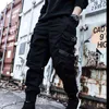 Pantaloni Hip Hop Pantaloni Harem neri da uomo Nastri multitasche Pantaloni sportivi da uomo Streetwear Pantaloni cargo da uomo Streetwear giapponese 211201