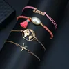 Europa e America Accessori moda stile bohémien Love Starfish Map Perla intrecciata Nappe Squisito braccialetto a quattro pezzi Catena a maglie