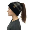 New style ladies plaid ponytail woolen CC cap, fashionable European and American curled edge warm knitting warm earmuff head hat