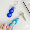 100 шт. 14 стилей толкание пузырьковая игрушка простые ямп -ключ кольцо скрипковые игрушки для ключей для взрослых роман для взрослых.