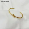 Huanzhi 2019 Ny design Rose Gold Metal Kopparpläterad Knot Twisted Armband för Kvinnor Tjej Bangle Party Smycken Gift Q0719