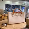 2022 Bamboo Ophidia Serpentine Stitching Bag Bag Ostrich Python Beige Canvas Läder Vintage Shoulder Italien Märke Womens Designer Handväska