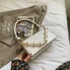 حقائب الكتف بيرل تصميم الذهب سلسلة صغيرة ستون نمط بو الجلود crossbody للنساء 2021 سيدة العصرية حقائب اليد وصفت