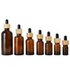 Amber Glass Droper -flaskor 5 ml 10 ml 15 ml 20 lm 30 ml 50 ml 100 ml med bambulock trä eteriska oljeflaskor