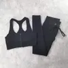ヨガアウトフィットスポーツセット女性リブスーツのトレーニング服シームレスジッパースポーツブラジャーと巾着レギンス2ピーススポーツウェア