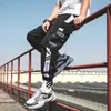 Nastri Hip Hop Pantaloni cargo da uomo Pantaloni da jogging Pantaloni da uomo Streetwear Pantaloni militari Moda maschile Pantaloni elastici in vita di cotone Nero 210714