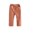 Pantalon décontracté en velours côtelé pour bébé Printemps Automne Vêtements pour enfants Bouton de couleur unie Pantalon pour filles 2-5-8-10 ans 210701
