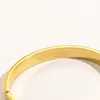 Bracciale rigido con lucchetto all'interno del perimetro 17 cm braccialetti con ciondoli color oro regalo per le feste ZG11802632