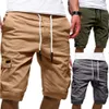 Hommes élégants pantalons courts d'été couleur unie multi-poches cordon cinquième pantalon shorts de plage 2021 printemps été vêtements pour hommes Y0408