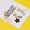 Cartoon Flower Car Metal Keyring Charm Bag For Airpods Square Pendant Fashion Metal Key Chains Trinket Couple Gift