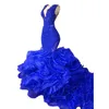 Robes de soirée en bleu royal Ruffles jupe à plusieurs niveaux Sirène pour femmes sans manches Vx sexy robe de bal appliques perles illusion