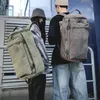 Sırt çantası 2021 büyük kapasiteli sırtlı adam seyahat çantası dağcılık erkek bagaj tuval kova omuz çantaları erkek sırt çantaları