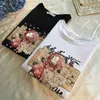 Été blanc t-shirt haut pour femme Vintage vêtements coréens femmes t-shirt décontracté Floral perles noir t-shirt à manches courtes mode 210604