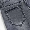 Pantaloni elastici grigi di moda coreana per le signore Pantaloni a matita da donna con bottoni a foro Jeans a vita alta in denim Pantalon 11721 210415