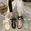 Perle sandalen weiblichen sommer Koreanische fee stil niet strand schuhe flache fliege kappe Römischen beiläufige hausschuhe 2021