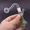 Nyaste Mini Glass Oil Rig Bong 10mm Kvinna Tjock Pyrex Bägare Travel Glas Vatten Bongs DAB Riggar för rökning med silikon halm