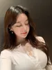 WOMENGAGA Corée Spring Summer Tops Sexy Slim Mesh Bouton de dentelle à manches longues T-shirt pour femmes Tshirt Sweet G88P 210603