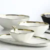 Set di stoviglie smerlate con bordo dorato di lusso Piatto di antipasti in ceramica increspato Zuppa di cereali Insalatiera Piatti da portata Piatto Bianco Nero