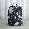 Fashion Young boys girls bags Large capacity mens and womens schoolbag Backpack Nylon Canvas Material Halo dyeing tie dyed Flower 282E