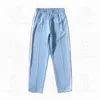 Calça feminina feminino esportivo designers de calça de pista de traje de pinça de casacos soltos jaquetas capuzes calças de moletom de arco -íris zíper das calças esportivas casuais