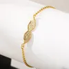 gold wing bracelet