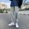 Mode masculine Street Fashion Impression Pantalon court Pantalon à jambe droite Pantalon mâle fendu Lettre Impression Pantalon de jogging Y0811
